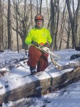 dennis chainsawing in winter