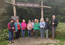 Hikers at entrance to Balsam Nature Trail